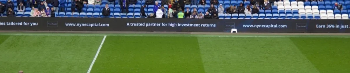 Cardiff City FC stadium with Nyne Capital pitchside branding